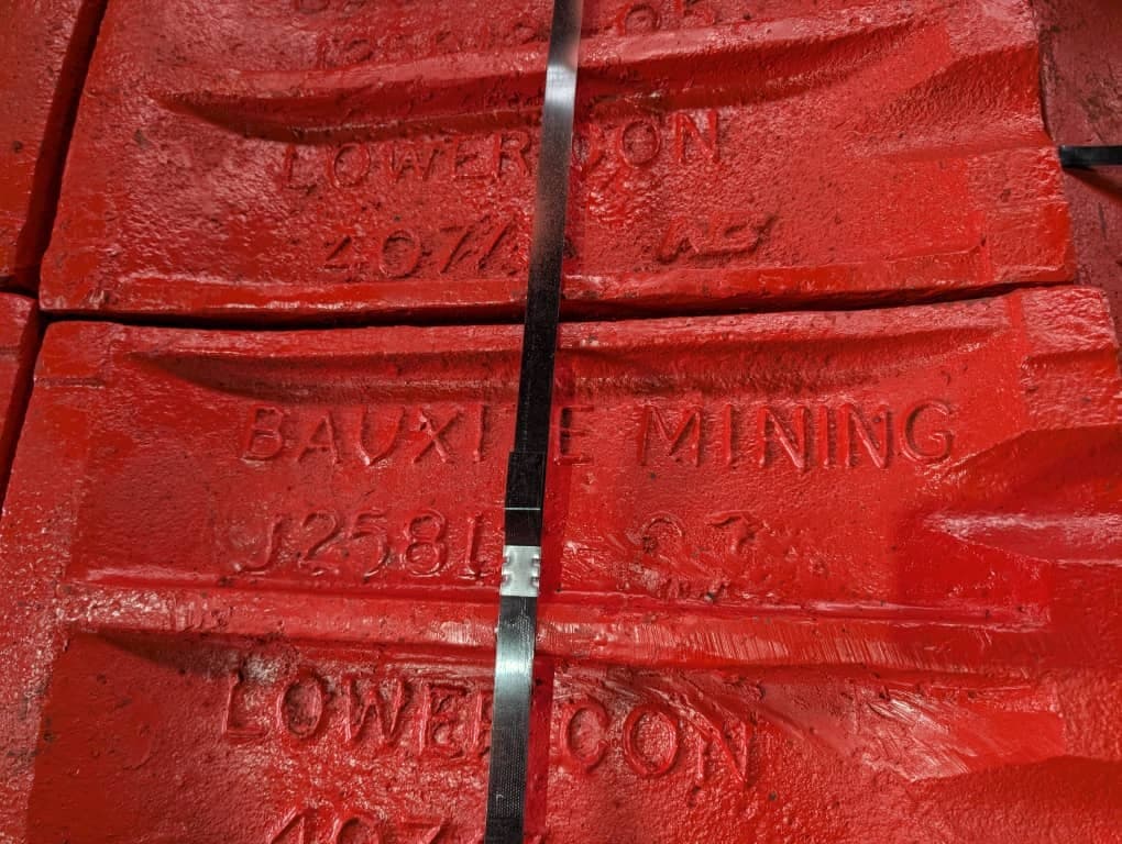 Factory photographed red crusher liners marked Bauxite Mining