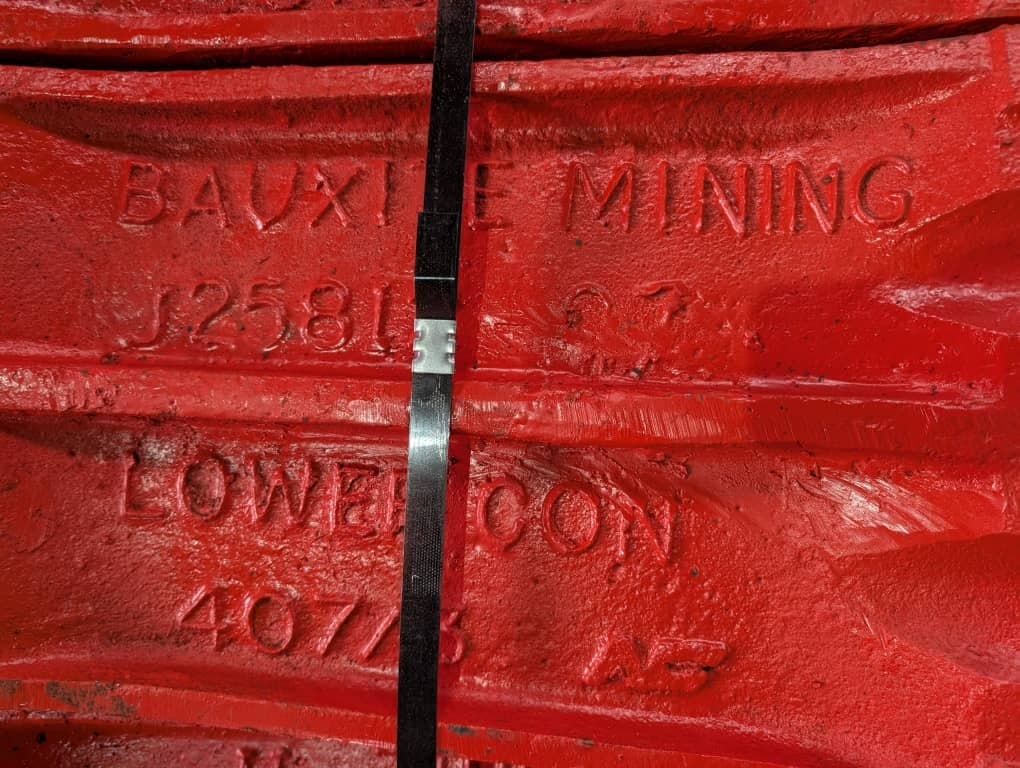 Red crusher liner castings photographed at the factory