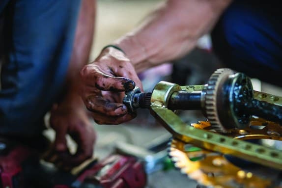 Technician maintaining industrial equipment